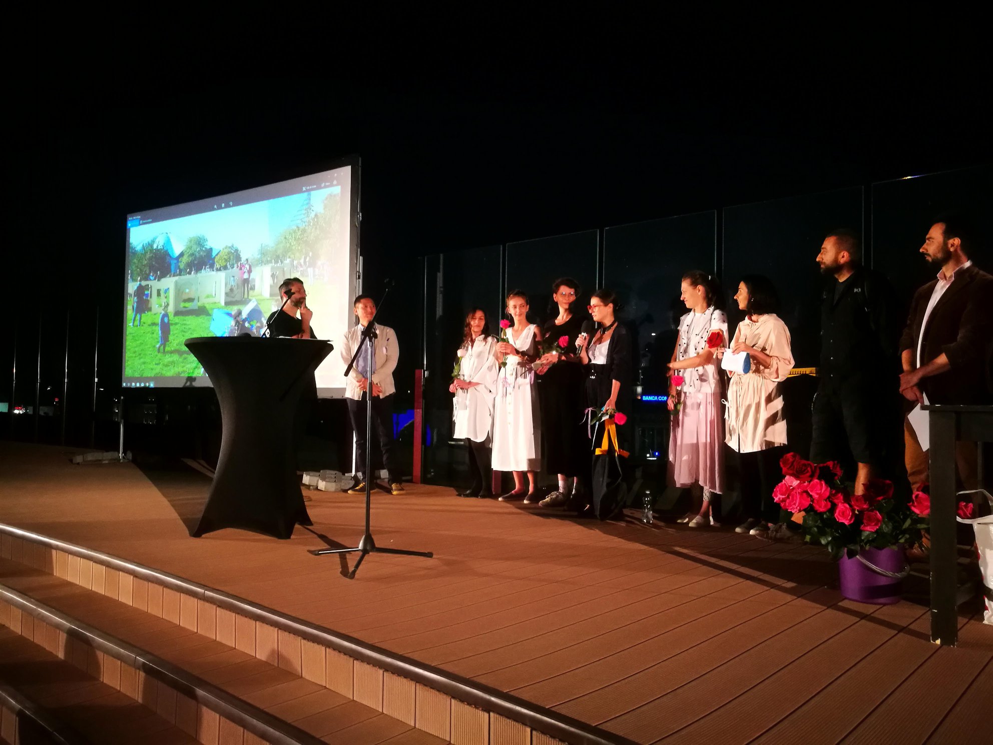 The whole team on stage receiving the prize.