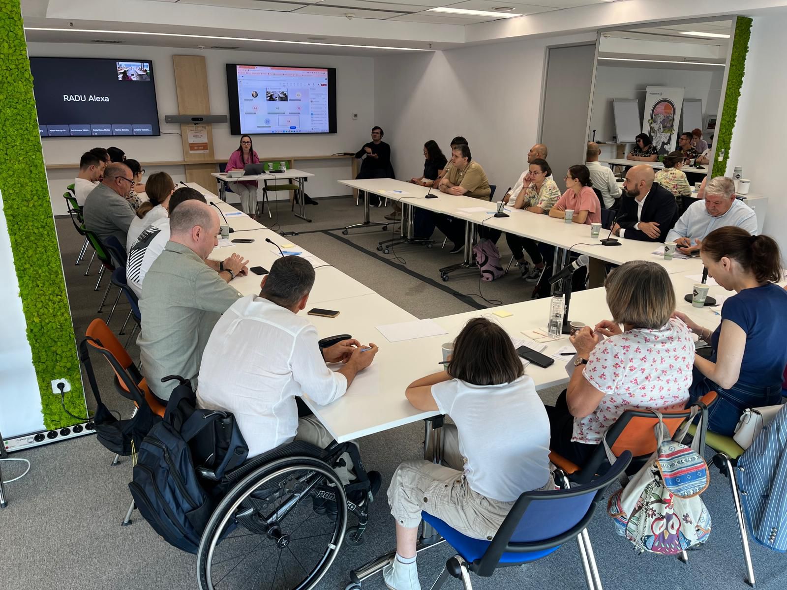 people with and without disabilities sitting around a table.